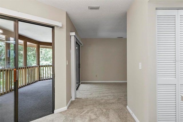 14 Oakmont Ct Unit 14, Palm Coast, FL 32137 - hallway featuring carpet and a textured ceiling