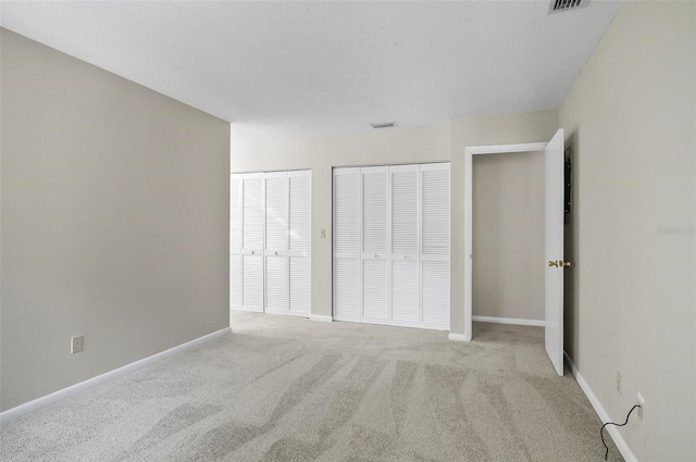 14 Oakmont Ct Unit 14, Palm Coast, FL 32137 - unfurnished bedroom featuring carpet floors and baseboards