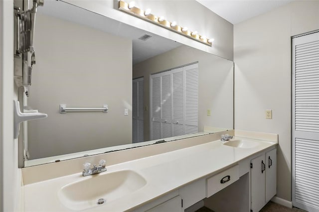 14 Oakmont Ct Unit 14, Palm Coast, FL 32137 - bathroom with a closet and double vanity