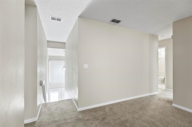 14 Oakmont Ct Unit 14, Palm Coast, FL 32137 - hall with carpet flooring and a textured ceiling