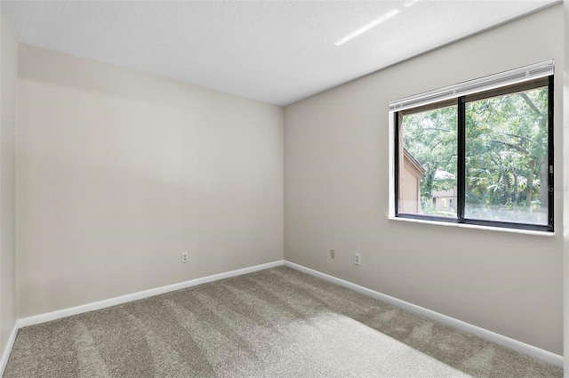 14 Oakmont Ct Unit 14, Palm Coast, FL 32137 - carpeted empty room featuring baseboards