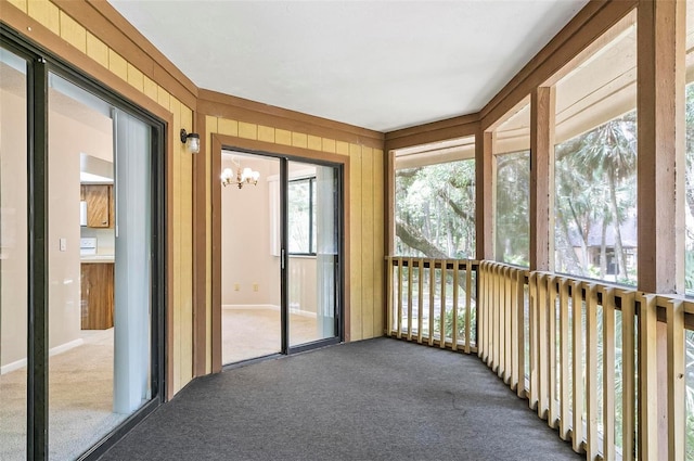 14 Oakmont Ct Unit 14, Palm Coast, FL 32137 - unfurnished sunroom with a chandelier