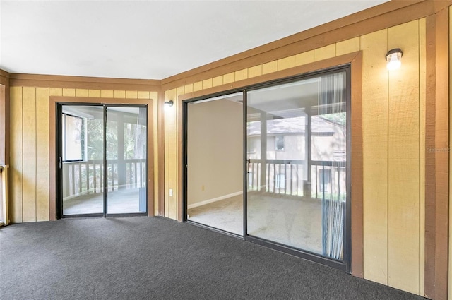 14 Oakmont Ct Unit 14, Palm Coast, FL 32137 - carpeted empty room with wooden walls