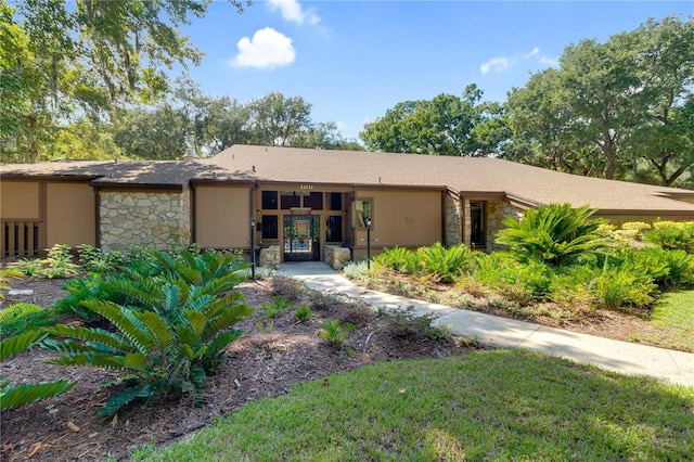 14 Oakmont Ct Unit 14, Palm Coast, FL 32137 - view of front facade with stone siding