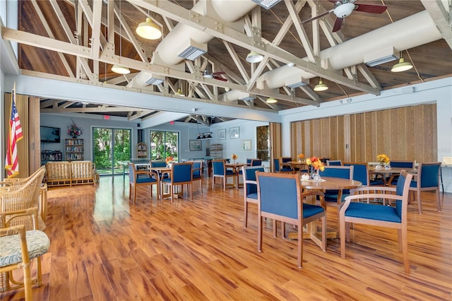 14 Oakmont Ct Unit 14, Palm Coast, FL 32137 - dining space with light wood-style floors, vaulted ceiling, and ceiling fan