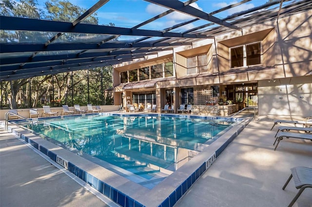 14 Oakmont Ct Unit 14, Palm Coast, FL 32137 - community pool with a patio and glass enclosure