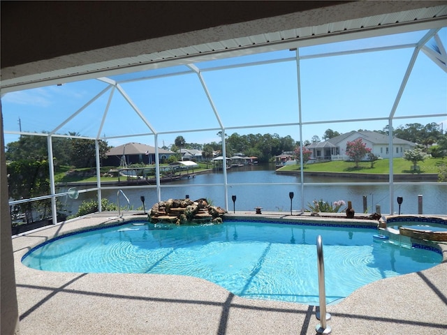 7 College Ct, Palm Coast, FL 32137 - view of swimming pool with glass enclosure, a water view, a pool with connected hot tub, and a patio