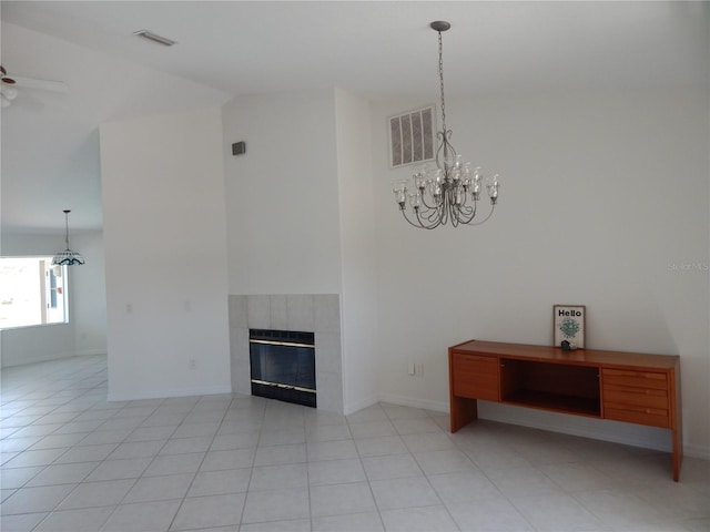 7 College Ct, Palm Coast, FL 32137 - unfurnished living room featuring a chandelier, ceiling fan, a tile fireplace, light tile patterned floors, and high vaulted ceiling
