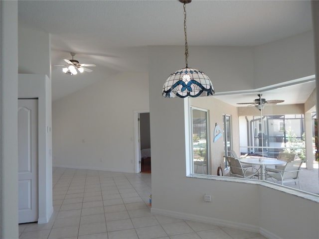 7 College Ct, Palm Coast, FL 32137 - unfurnished dining area featuring ceiling fan, healthy amount of natural light, lofted ceiling, and tile patterned flooring