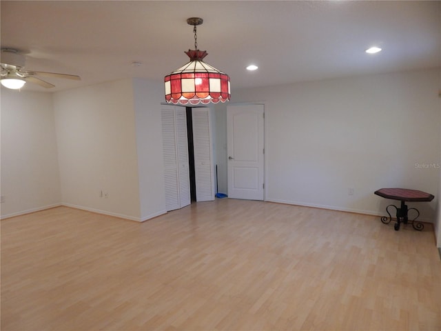 7 College Ct, Palm Coast, FL 32137 - empty room featuring light wood-style floors, a ceiling fan, and recessed lighting