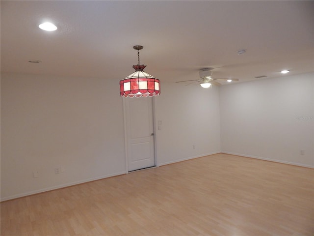7 College Ct, Palm Coast, FL 32137 - empty room with light wood-style floors, ceiling fan, and recessed lighting