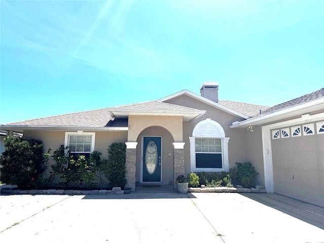 7 College Ct, Palm Coast, FL 32137 - view of front of home with stucco siding, an attached garage, a chimney, and a shingled roof