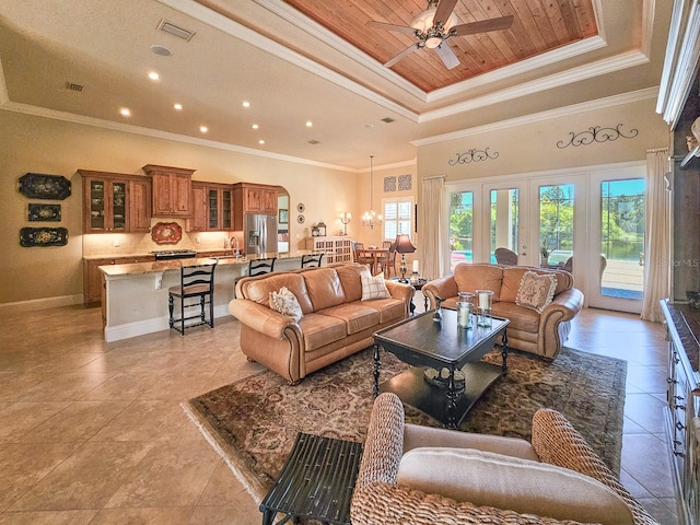 145 Heron Dr, Palm Coast, FL 32137 - living room featuring a raised ceiling, ceiling fan, light tile patterned floors, ornamental molding, and wood ceiling