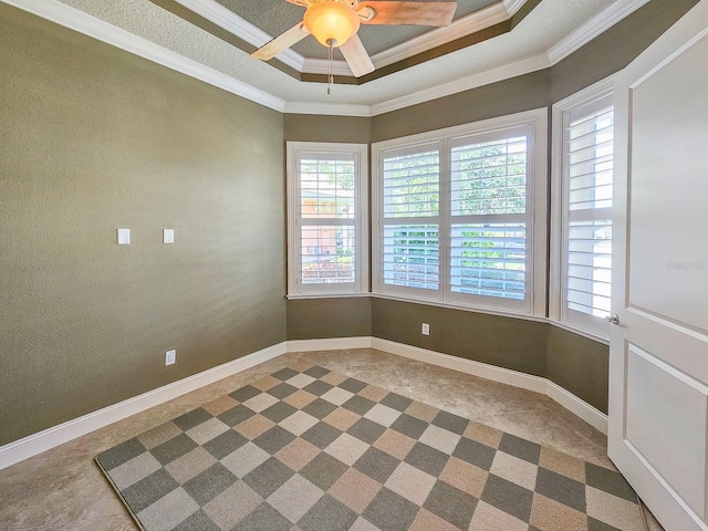 145 Heron Dr, Palm Coast, FL 32137 - unfurnished room with plenty of natural light, ornamental molding, ceiling fan, and a tray ceiling