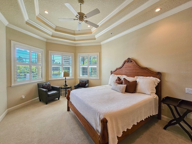 145 Heron Dr, Palm Coast, FL 32137 - bedroom with multiple windows, carpet flooring, a raised ceiling, ornamental molding, and a textured ceiling