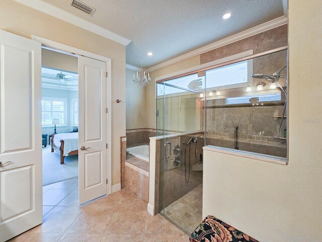 145 Heron Dr, Palm Coast, FL 32137 - ensuite bathroom with ornamental molding, a garden tub, tiled shower, a textured ceiling, and tile patterned flooring