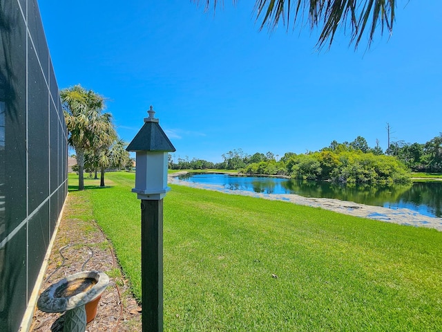 145 Heron Dr, Palm Coast, FL 32137 - view of grassy yard featuring a water view and a lanai