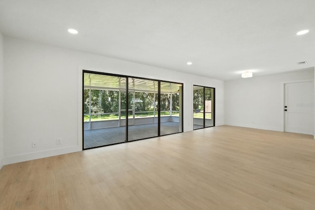 43 Courtney Pl, Palm Coast, FL 32137 - unfurnished room featuring light wood-type flooring and recessed lighting