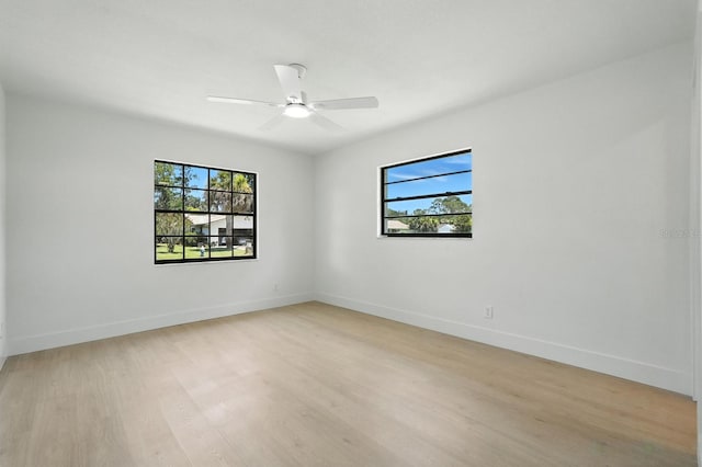 43 Courtney Pl, Palm Coast, FL 32137 - spare room featuring healthy amount of natural light, light wood-style flooring, and a ceiling fan