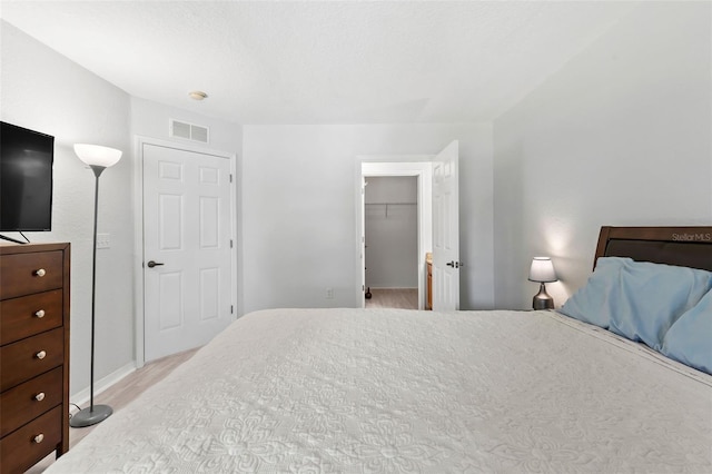 4600 E Moody Blvd Unit 14O, Bunnell, FL 32110 - bedroom featuring a spacious closet and light wood-style flooring