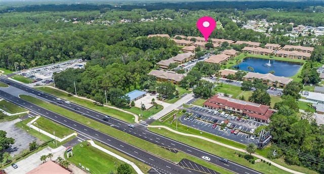 4600 E Moody Blvd Unit 14O, Bunnell, FL 32110 - aerial view of property's location featuring a heavily wooded area and a nearby body of water