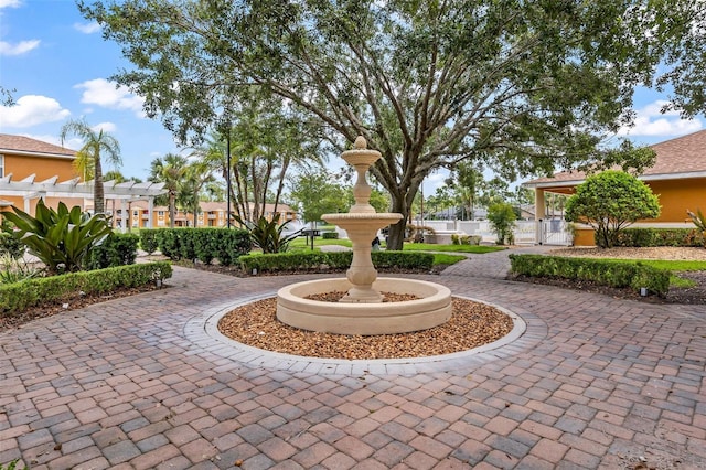 4600 E Moody Blvd Unit 14O, Bunnell, FL 32110 - surrounding community featuring a pergola and curved driveway