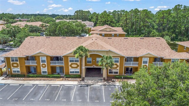 4600 E Moody Blvd Unit 14O, Bunnell, FL 32110 - view of property featuring uncovered parking