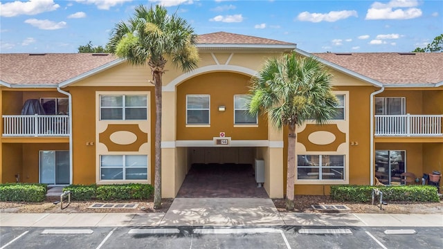 4600 E Moody Blvd Unit 14O, Bunnell, FL 32110 - view of property featuring uncovered parking