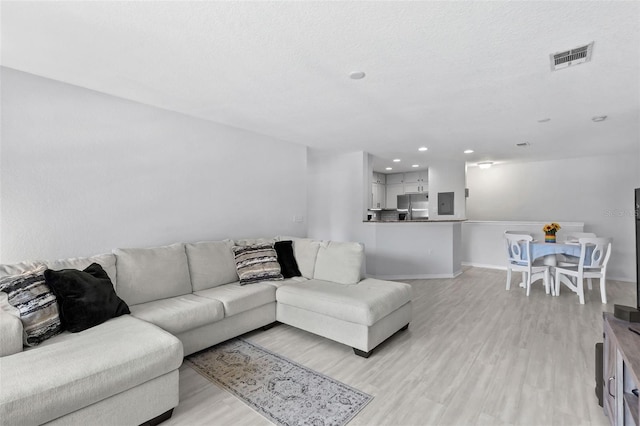 4600 E Moody Blvd Unit 14O, Bunnell, FL 32110 - living area with light wood finished floors, recessed lighting, and electric panel