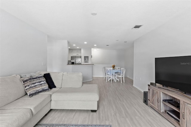 4600 E Moody Blvd Unit 14O, Bunnell, FL 32110 - living room with light wood-style flooring and recessed lighting