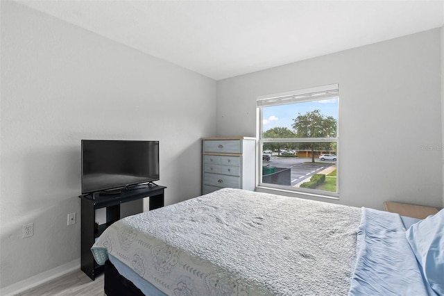 4600 E Moody Blvd Unit 14O, Bunnell, FL 32110 - bedroom featuring baseboards and light wood-style floors