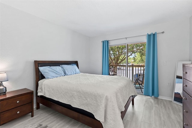 4600 E Moody Blvd Unit 14O, Bunnell, FL 32110 - bedroom featuring access to exterior and light wood-type flooring