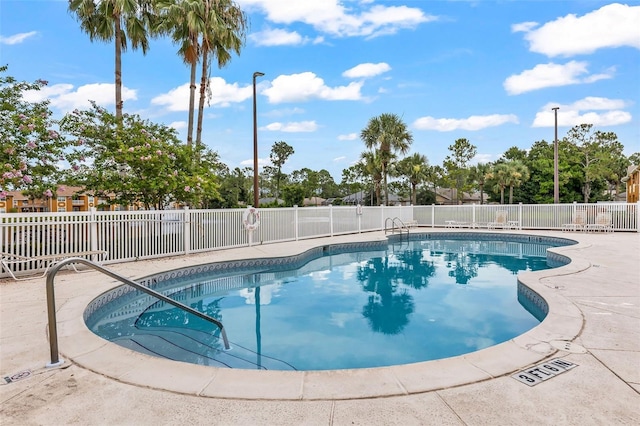 4600 E Moody Blvd Unit 14O, Bunnell, FL 32110 - community pool featuring a patio area