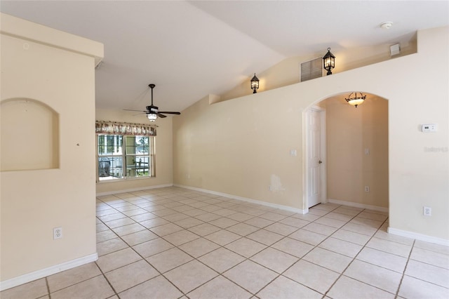 25 Raintree Pl, Palm Coast, FL 32164 - spare room with light tile patterned flooring, arched walkways, vaulted ceiling, ceiling fan, and a smoke detector