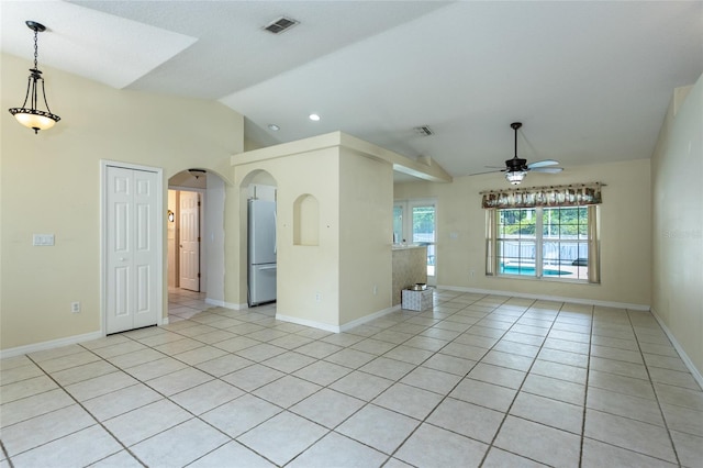25 Raintree Pl, Palm Coast, FL 32164 - empty room with vaulted ceiling, a ceiling fan, light tile patterned flooring, arched walkways, and recessed lighting