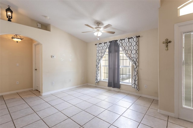 25 Raintree Pl, Palm Coast, FL 32164 - spare room featuring ceiling fan, arched walkways, light tile patterned floors, and a smoke detector