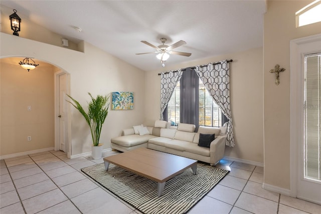25 Raintree Pl, Palm Coast, FL 32164 - living area with arched walkways, ceiling fan, light tile patterned floors, and lofted ceiling