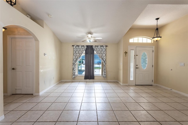 25 Raintree Pl, Palm Coast, FL 32164 - foyer entrance featuring ceiling fan, healthy amount of natural light, light tile patterned floors, and arched walkways