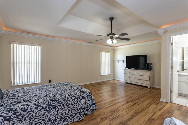 25 Raintree Pl, Palm Coast, FL 32164 - bedroom with wood finished floors, ornamental molding, ceiling fan, and connected bathroom