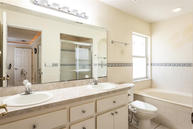 25 Raintree Pl, Palm Coast, FL 32164 - full bath featuring a garden tub, double vanity, a shower stall, tile walls, and tile patterned floors