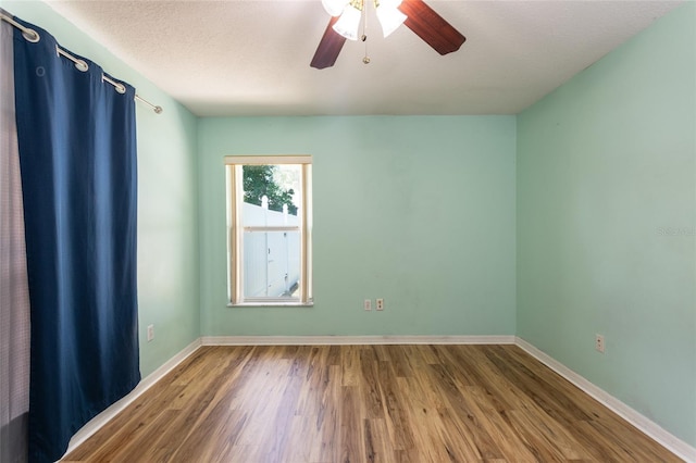 25 Raintree Pl, Palm Coast, FL 32164 - empty room with a ceiling fan and wood finished floors