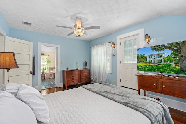 1221 Gamble Pl, Daytona Beach, FL 32118 - bedroom with wood finished floors, a ceiling fan, and ensuite bathroom