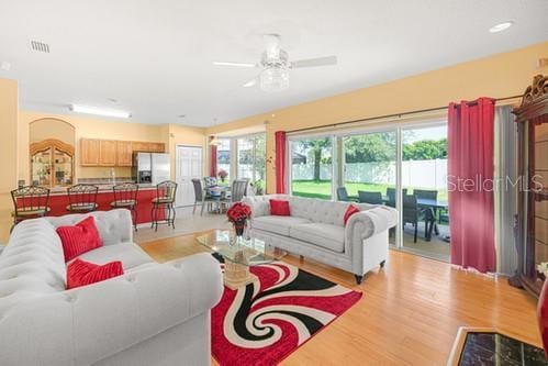 7 Flint Pl, Palm Coast, FL 32137 - living area with light wood-style flooring and ceiling fan