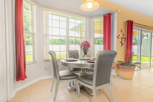 7 Flint Pl, Palm Coast, FL 32137 - tiled dining room with baseboards