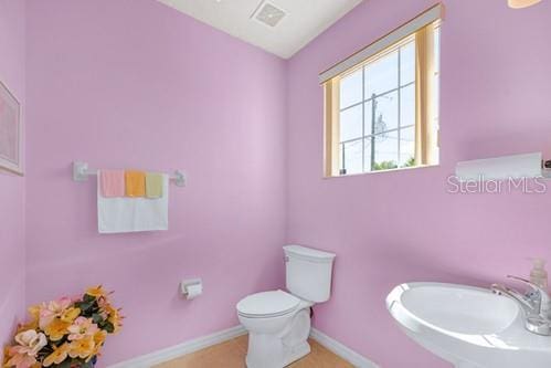 7 Flint Pl, Palm Coast, FL 32137 - bathroom with toilet and tile patterned flooring