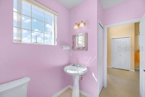 7 Flint Pl, Palm Coast, FL 32137 - bathroom featuring plenty of natural light