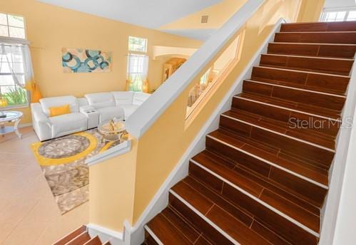 7 Flint Pl, Palm Coast, FL 32137 - stairs featuring wood finished floors