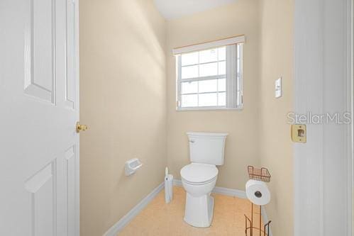 7 Flint Pl, Palm Coast, FL 32137 - bathroom with toilet and baseboards