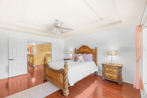 7 Flint Pl, Palm Coast, FL 32137 - bedroom with a raised ceiling and wood finished floors