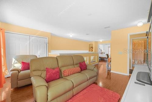 7 Flint Pl, Palm Coast, FL 32137 - living area featuring wood finished floors